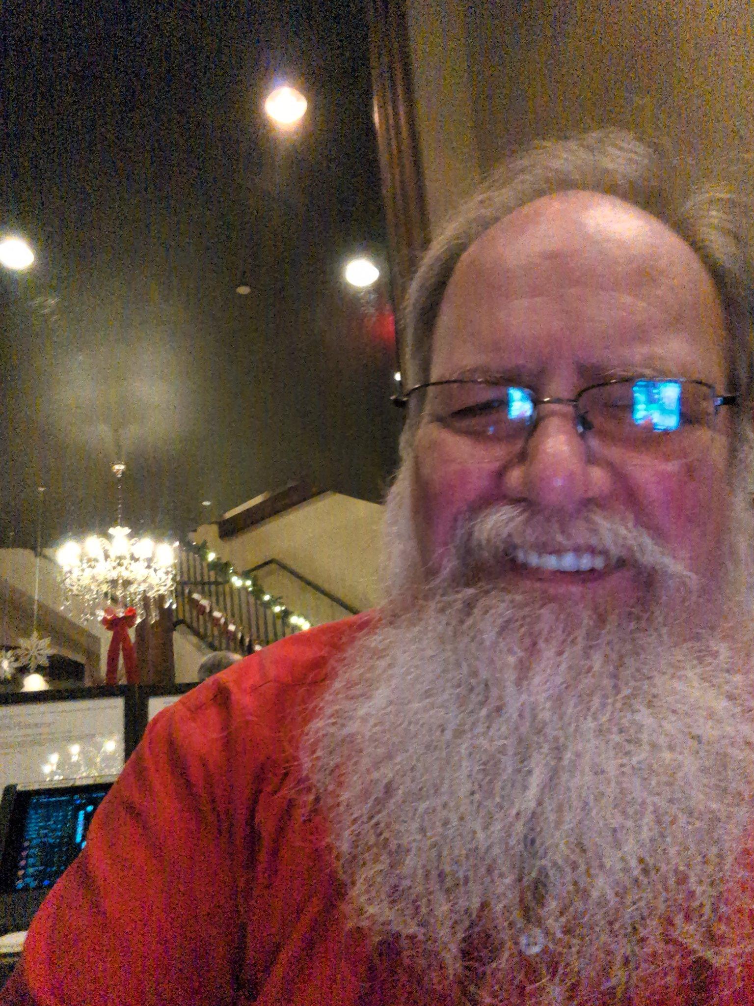 Stage Christmas Party — Jeffry in a red shirt by a garlanded staircase — from the Christmas collection